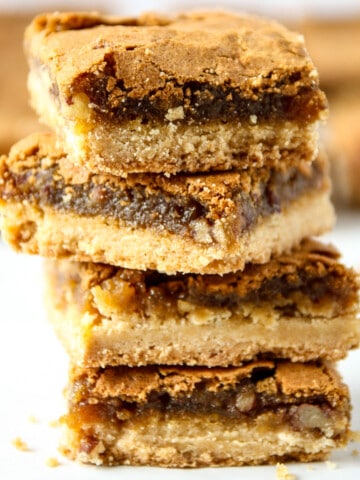 A stack of four butter tart squares.