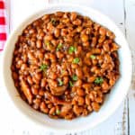 Slow Cooker Baked Beans in a white bowl.