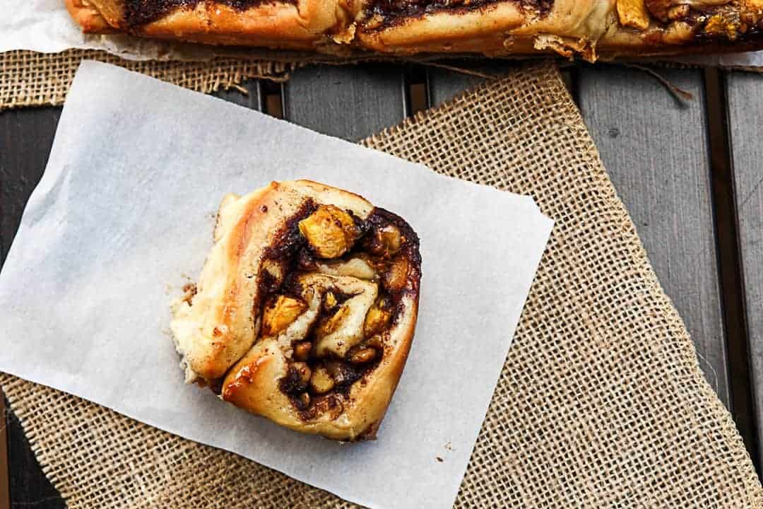 A sweet roll  sitting on top of a table