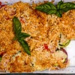 A casserole dish is filled with food