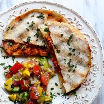 A plate of food with a with Quesadillas and Salsa