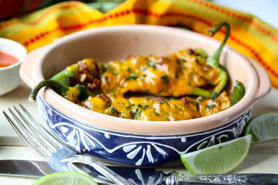 A bowl of food on a plate, with Stuffing and Beef