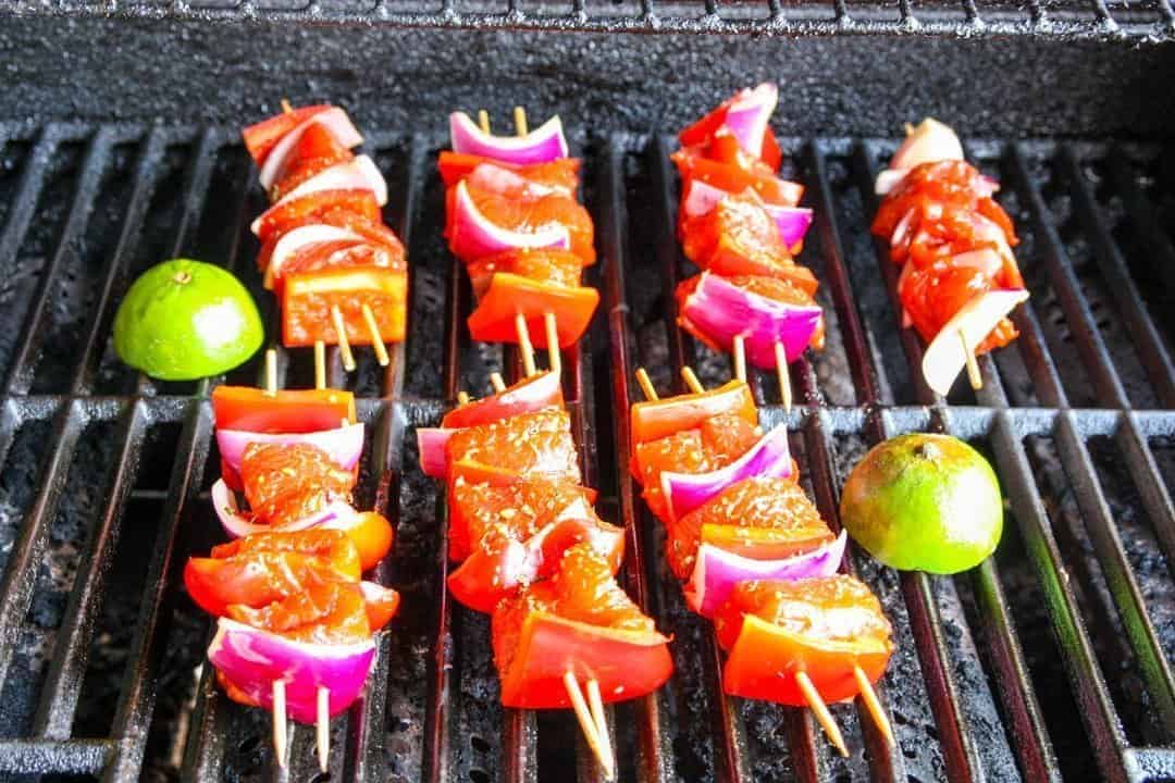 A bunch of food on a grill, with Salmon 