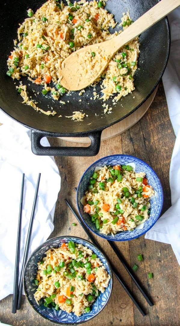 A bowl of food on a table, with Fried rice