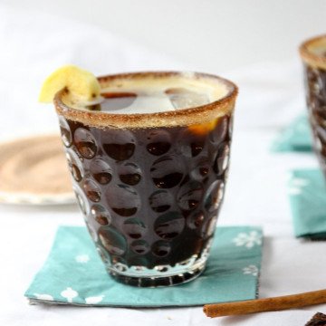 A rum cocktail in a glass on a table