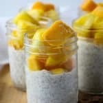 A close up of chia pudding in a jar, with fruit