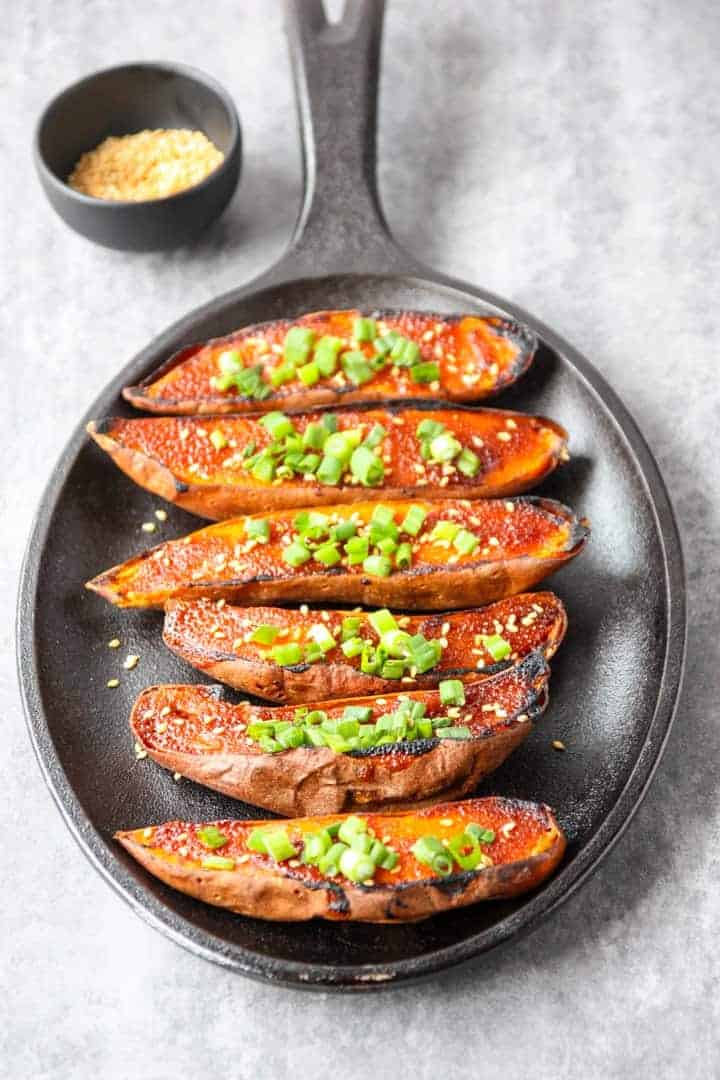 A pan of roasted miso sweet potatoes on a table.