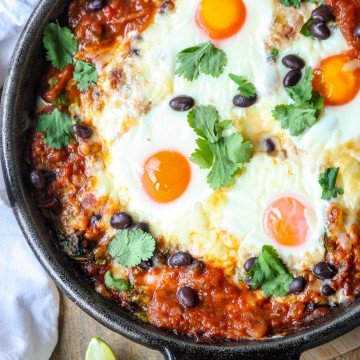 Baked heuvos rancheros in a cast iron skillet