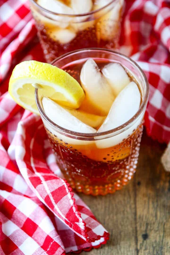 A glass on a table, with Iced tea
