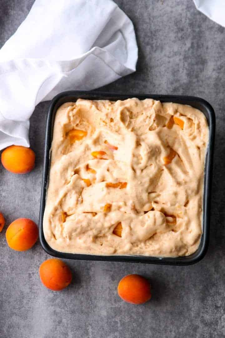 Apricot Marscarpone Ice Cream in a square black dish.