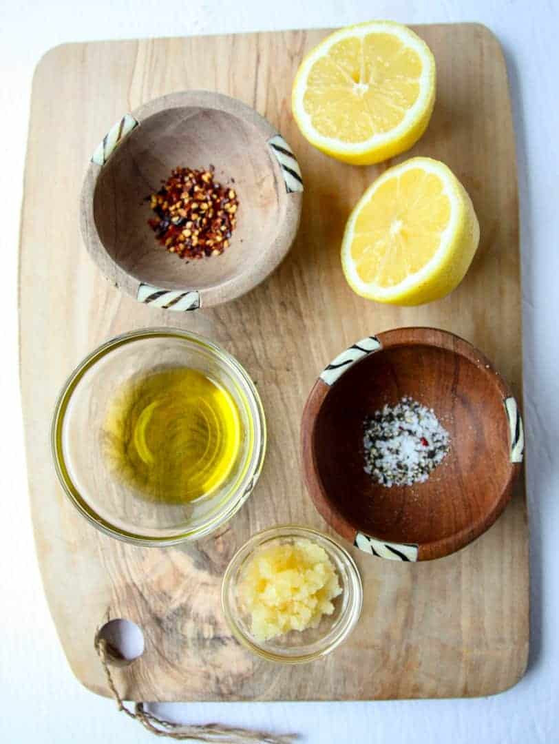 The ingredients used to make this recipe on a wooden board.