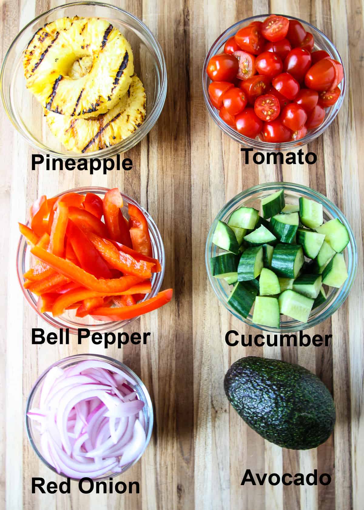 The salad ingredients on a wooden board.