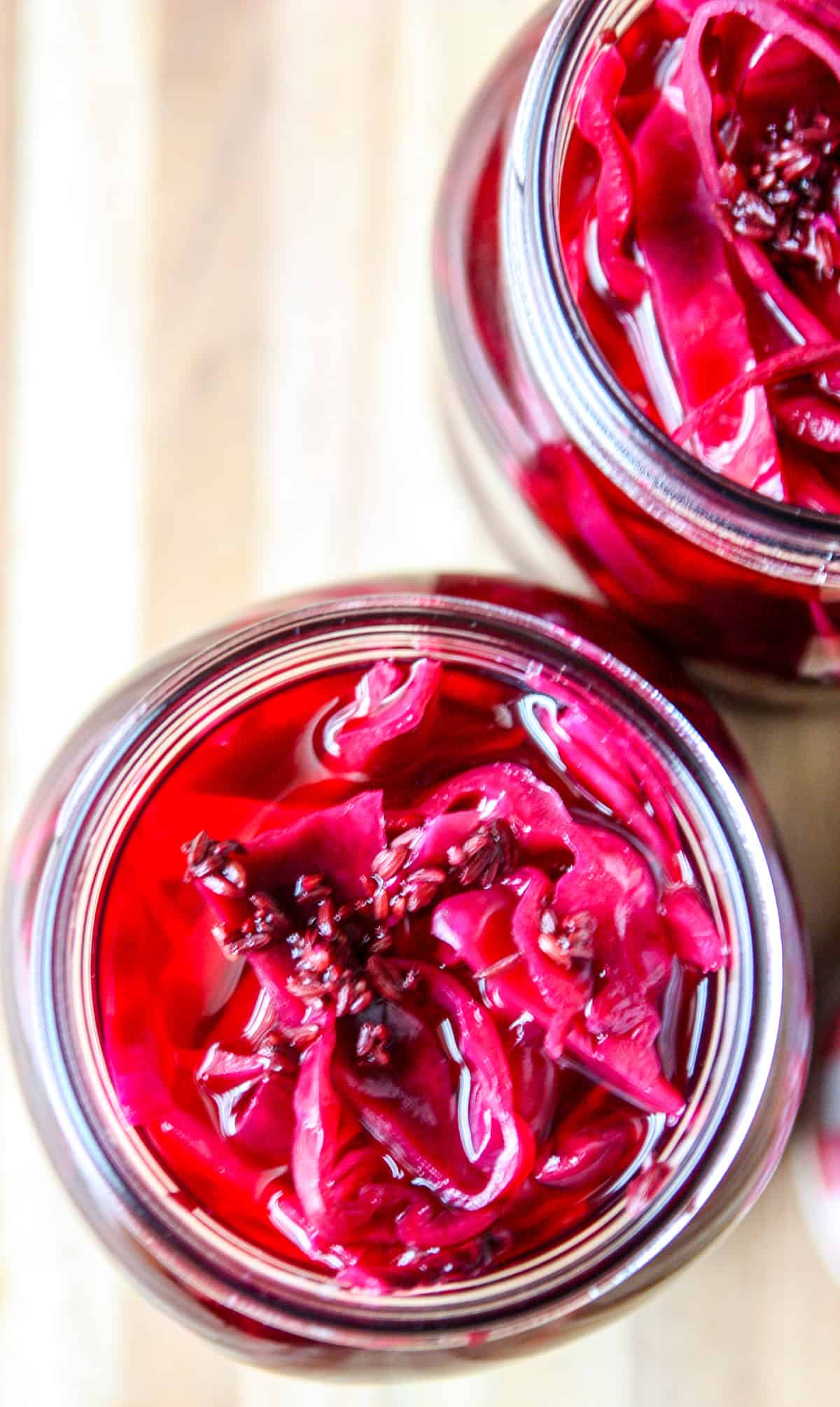 A close up of a jar of quick pickled red cabbage.