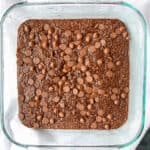Chocolate baked oats in a square glass pan.