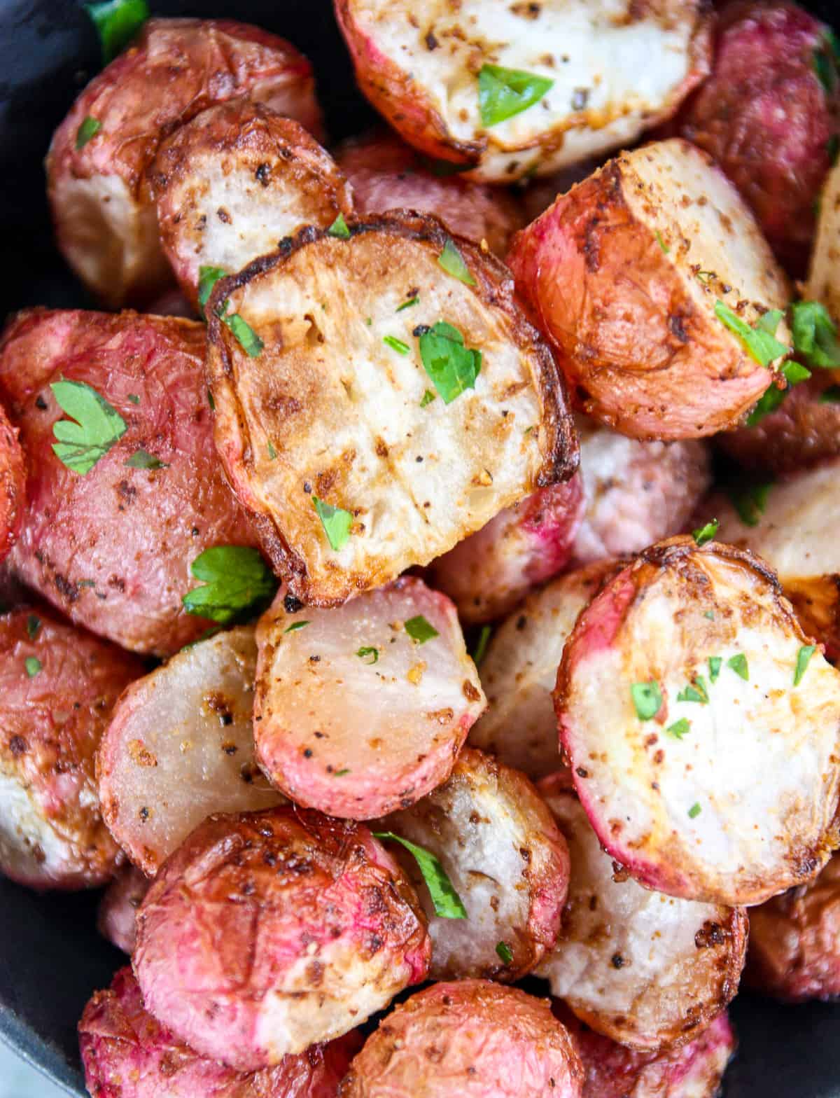 Air fried radishes garnished with parsley.