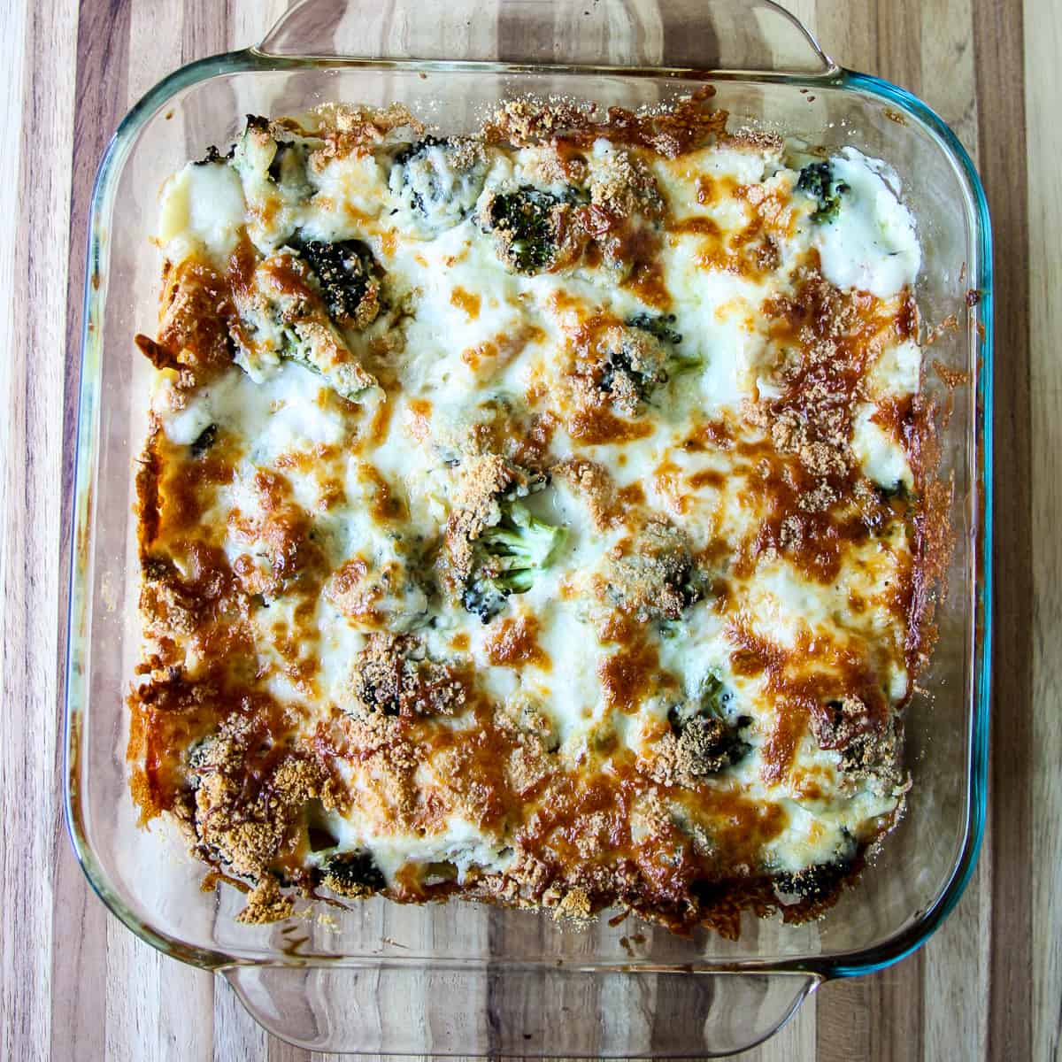 The finished lasagna after baking in a glass baking dish.