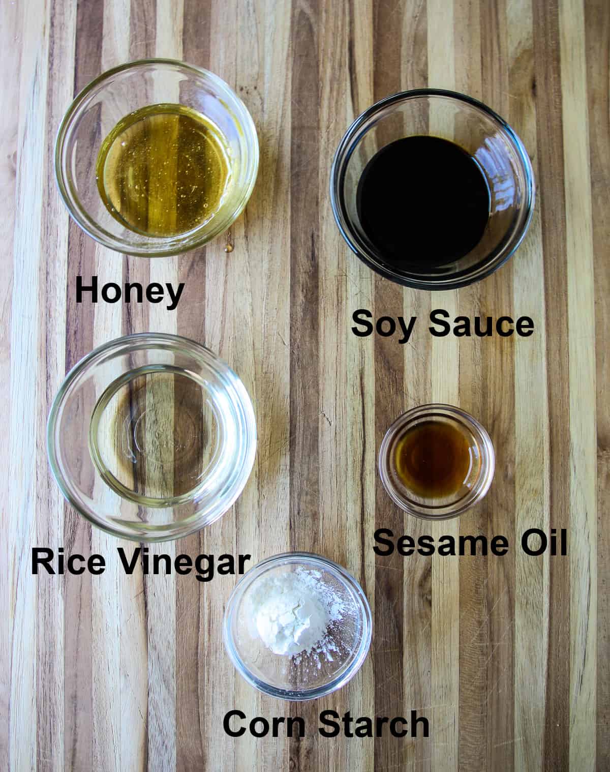 The ingredients for making the meatball sauce, in glass bowls.