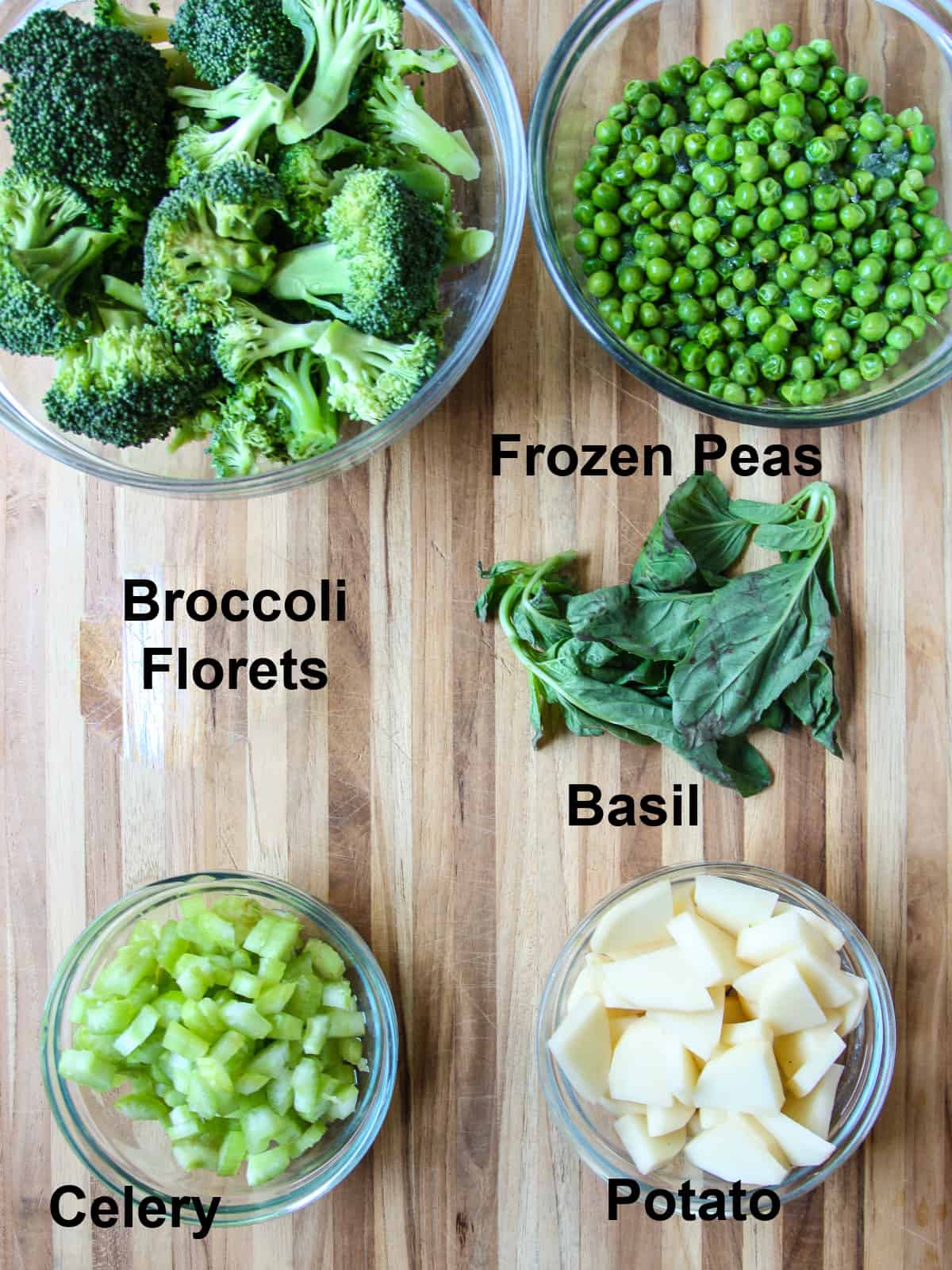 The vegetable ingredients for this recipe in glass bowls.