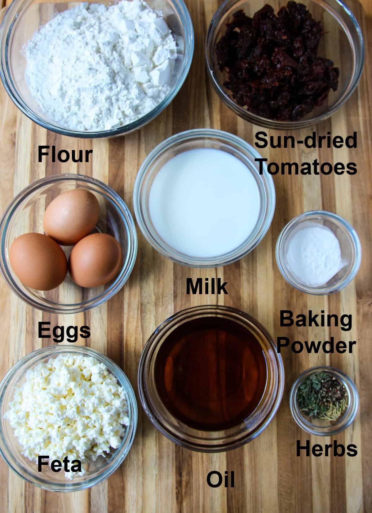 The ingredients for making this recipe in glass bowls on a wooden board.
