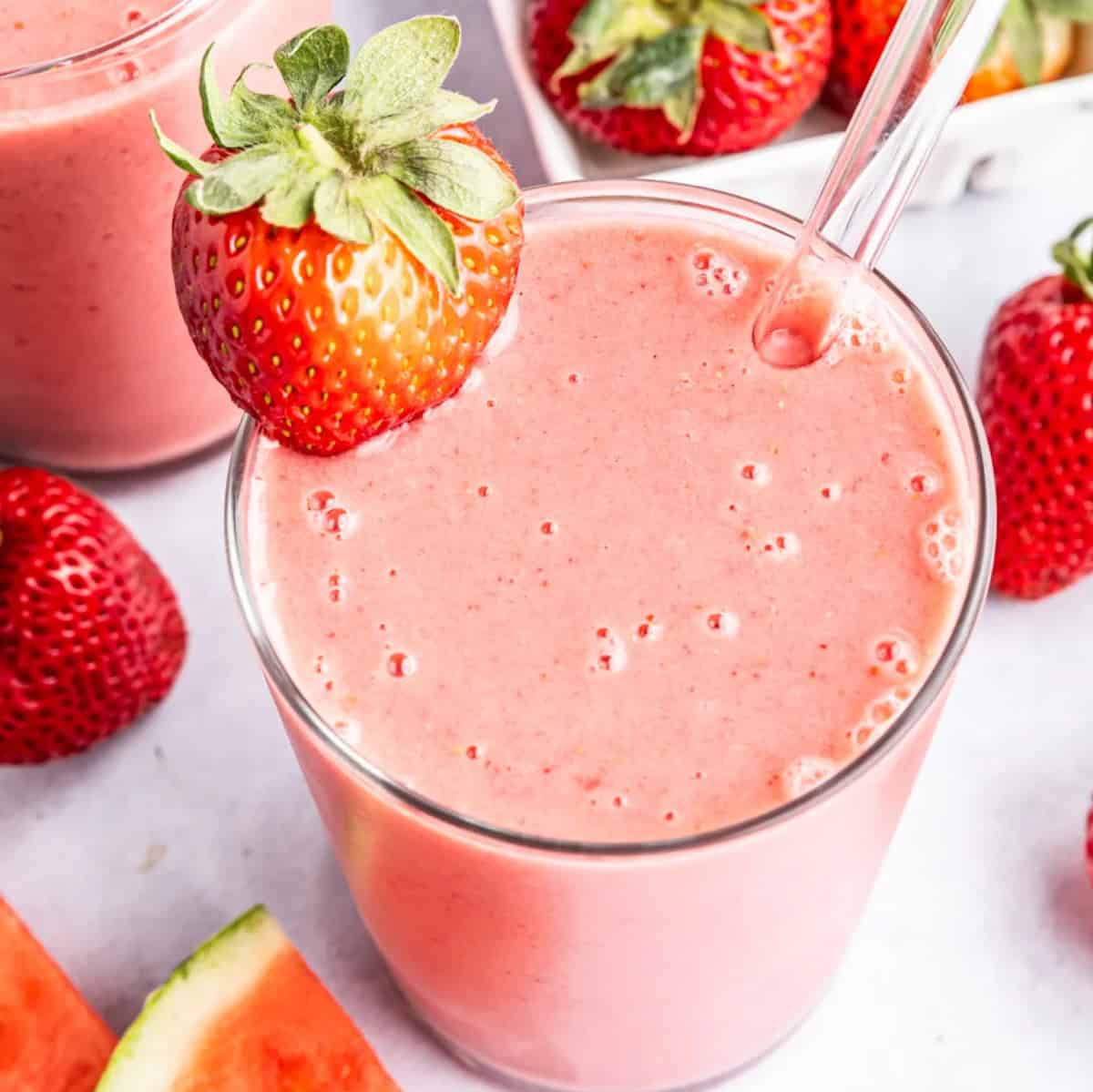 Pink strawberry watermelon smoothie in a glass.