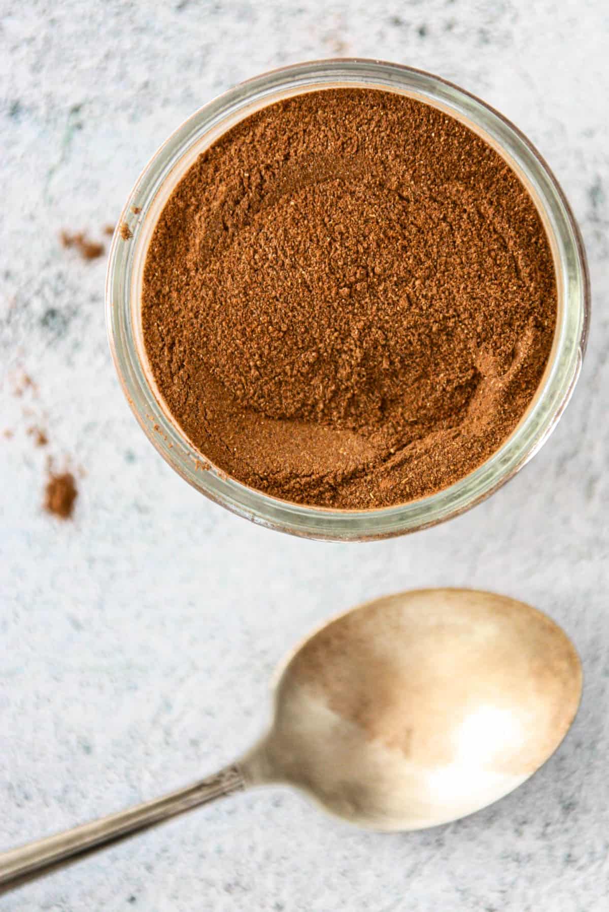 A glass jar of homemade pumpkin pie spice.