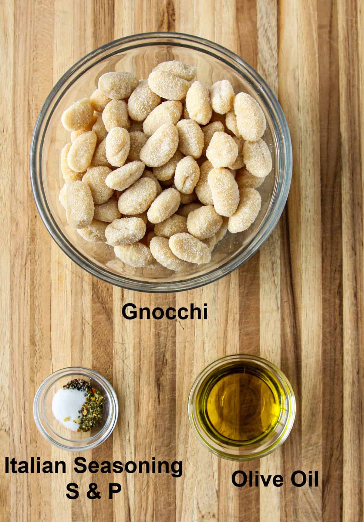 The ingredients for making this recipe, in glass bowls on a wooden board.